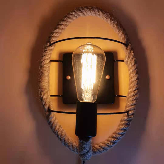 Rustic Indoor Wall Light With Wagon Wheel Design And Rope Shade