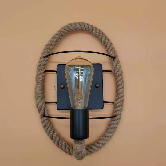 Rustic Indoor Wall Light With Wagon Wheel Design And Rope Shade