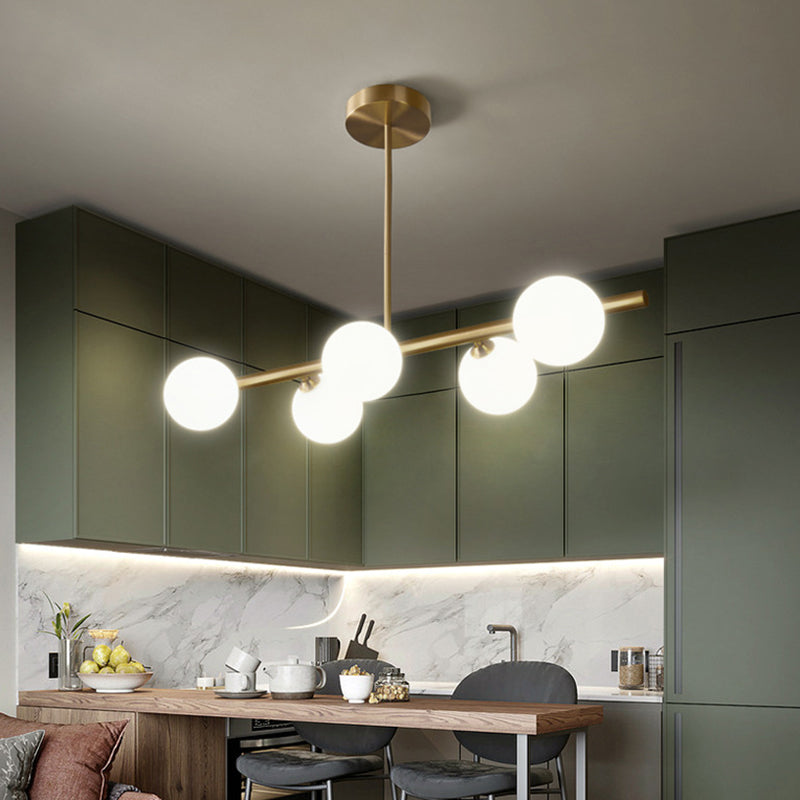 Sleek and Elegant Linear Gold Island Pendant Lighting with Spherical Glass Shades for Dining Table