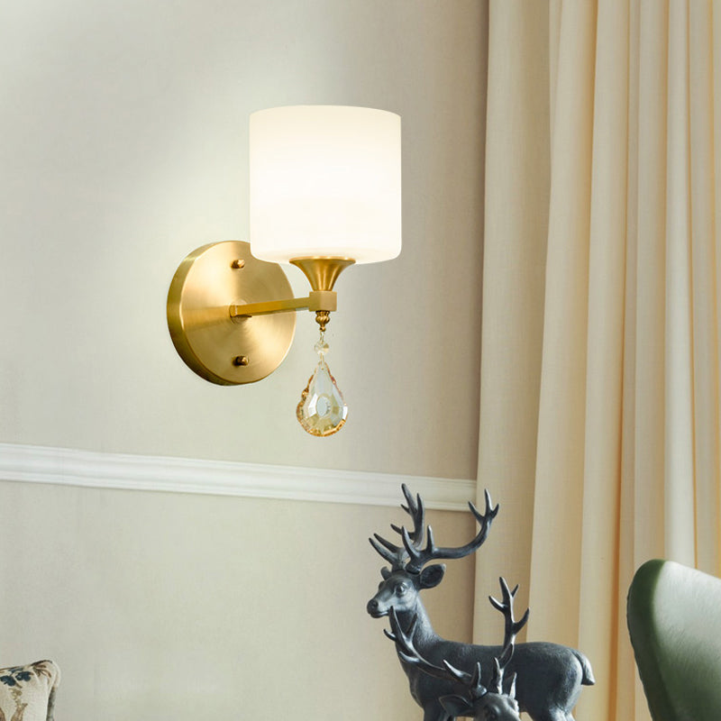 Modern Milk Glass Wall Sconce With Brass Finish And Amber Crystal Draping