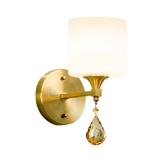 Modern Milk Glass Wall Sconce With Brass Finish And Amber Crystal Draping