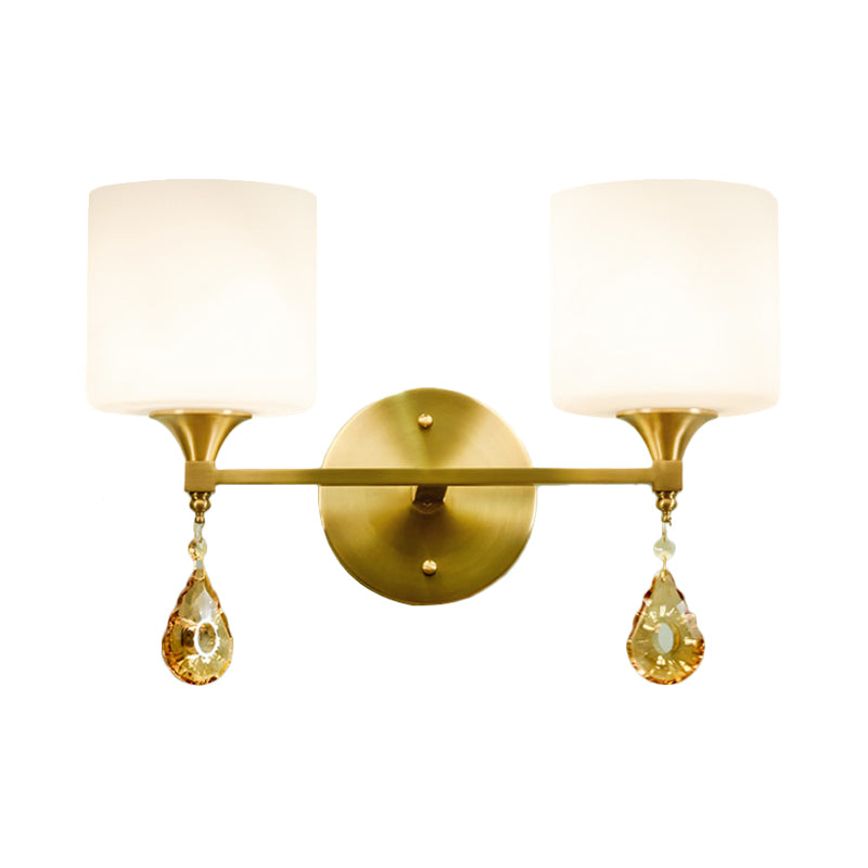 Modern Milk Glass Wall Sconce With Brass Finish And Amber Crystal Draping