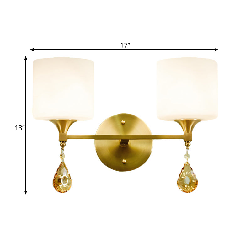 Modern Milk Glass Wall Sconce With Brass Finish And Amber Crystal Draping