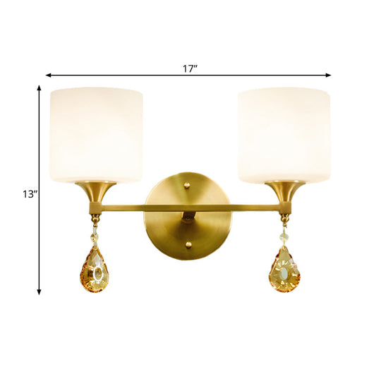 Modern Milk Glass Wall Sconce With Brass Finish And Amber Crystal Draping