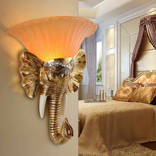 Modern Amber Glass Sconce With Gold Elephant Accent