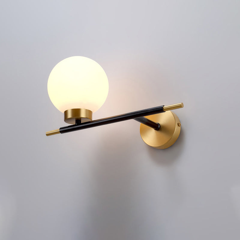 Post-Modern White Glass Sphere Wall Sconce With Brass Finish - 1/2 Bulbs