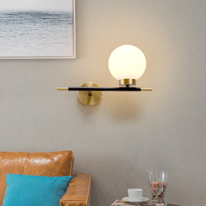 Post-Modern White Glass Sphere Wall Sconce With Brass Finish - 1/2 Bulbs