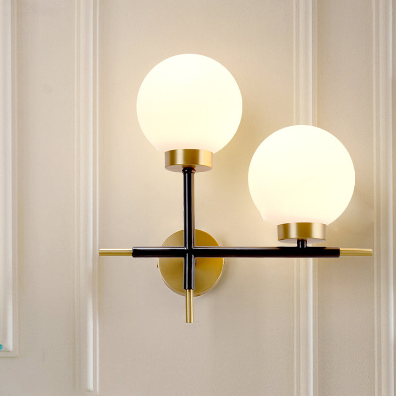 Post-Modern White Glass Sphere Wall Sconce With Brass Finish - 1/2 Bulbs