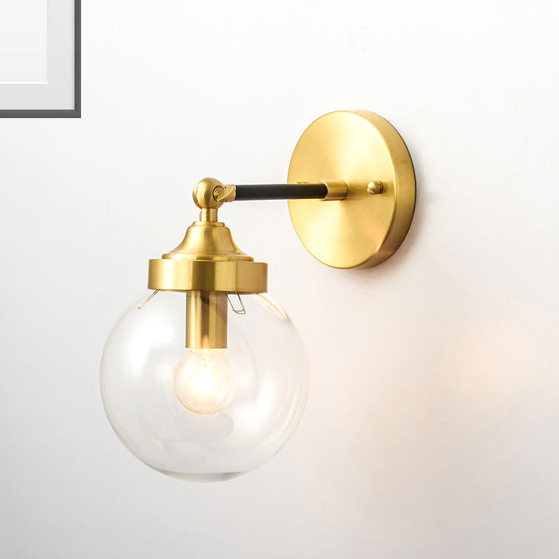 Simplicity Adjustable Globe Sconce Light Brass Wall Mount Lamp - 1 Bulb With Transparent Glass Shade