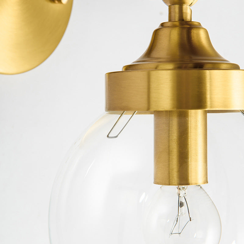 Simplicity Adjustable Globe Sconce Light Brass Wall Mount Lamp - 1 Bulb With Transparent Glass Shade