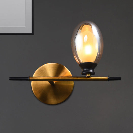 Elegant Clear/Amber Glass Egg Shape Wall Light - Minimalist 1 Brass Sconce Amber