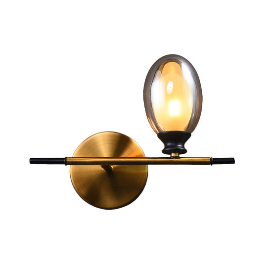 Elegant Clear/Amber Glass Egg Shape Wall Light - Minimalist 1 Brass Sconce