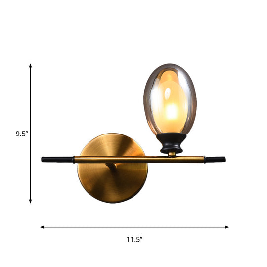 Elegant Clear/Amber Glass Egg Shape Wall Light - Minimalist 1 Brass Sconce