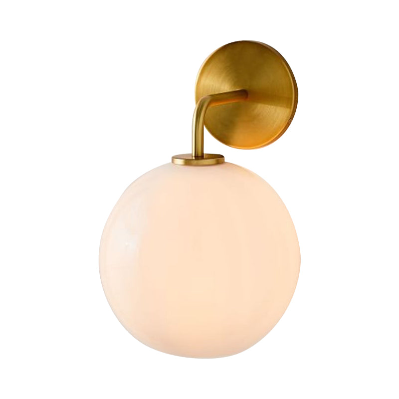 Modern Glass Orb Wall Sconce With Brass Arm Clear/White