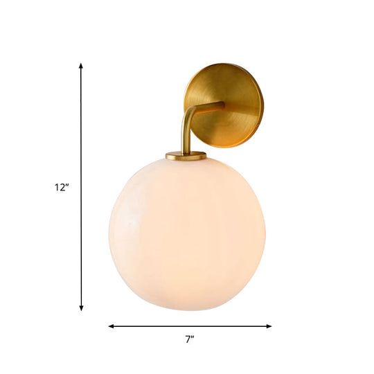 Modern Glass Orb Wall Sconce With Brass Arm Clear/White