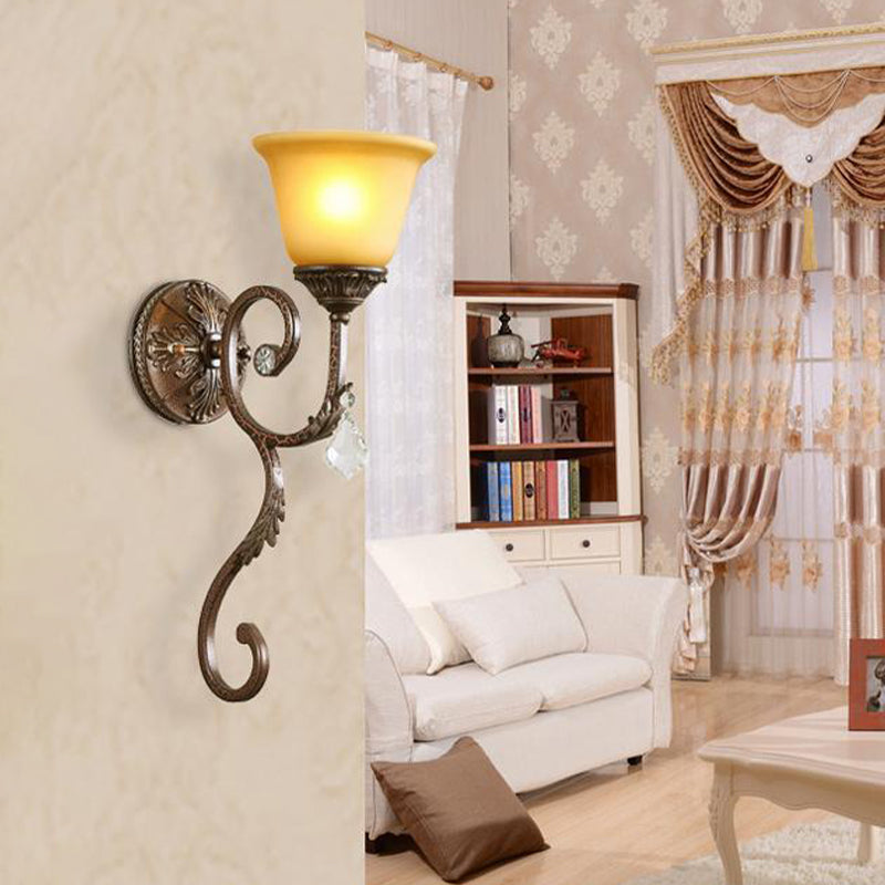 Traditional Amber Glass Sconce Lamp With Swirled Arm - Wall Mounted Corner Fixture In Bronze