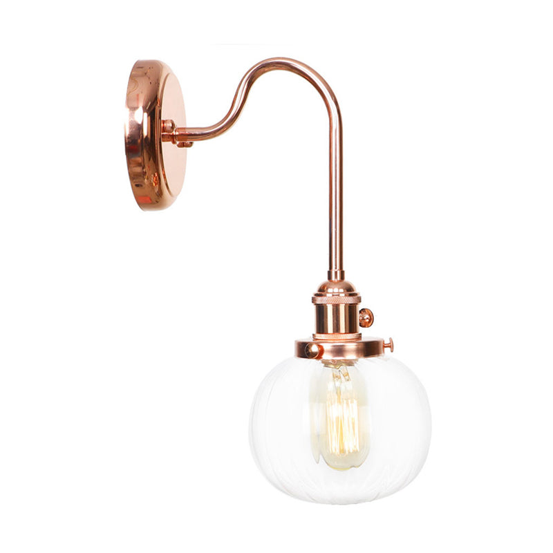 Copper Vintage Globe Wall Sconce With Curved Arm And Clear/Amber Glass - 1 Light