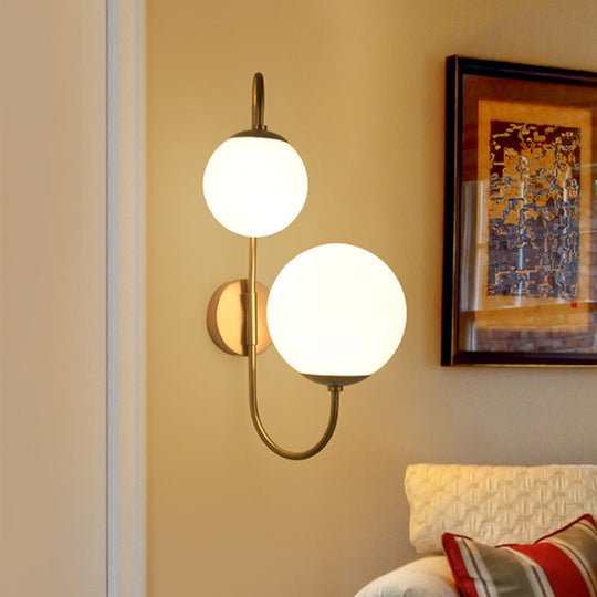 Contemporary Gold Metal Wall Sconce With Opal Glass Shade - 2 Bulb Arm Design