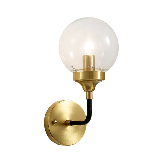 Clear Glass Globe Wall Sconce Light Fixture - Simple Brass With Curved Arm