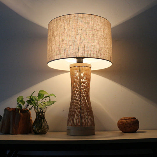 Flaxen Laser Cut Bamboo Desk Lamp With Asian-Inspired Design And Fabric Drum Shade