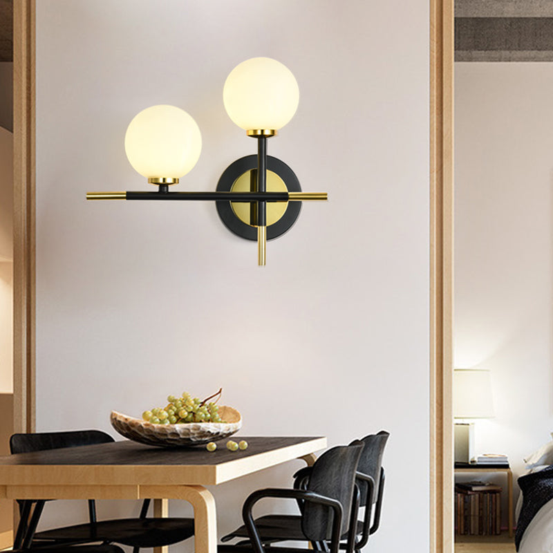 Modern Milk Glass Orb Sconce Wall Light - 2 Lights Black And Brass Cross Design White