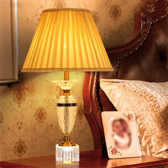 Modern Urn Shape Fabric Desk Light - Faceted Crystal 1 Bulb Night Table Lamp In Beige