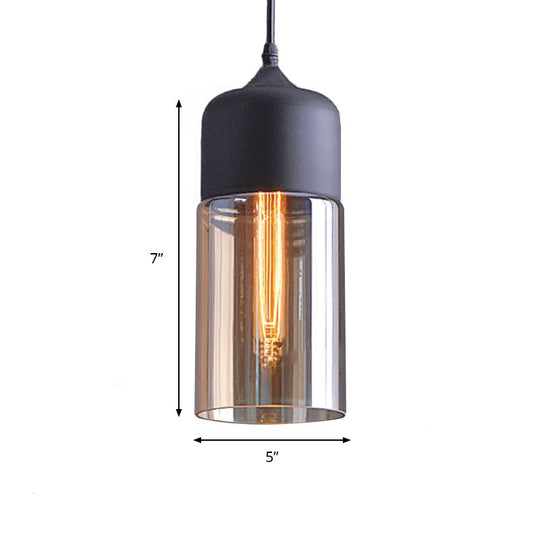 Industrial Cylinder Pendant Light with Brown Glass Shade - 1-Light Hanging Ceiling Fixture in Black, 5"/7"/8" Wide