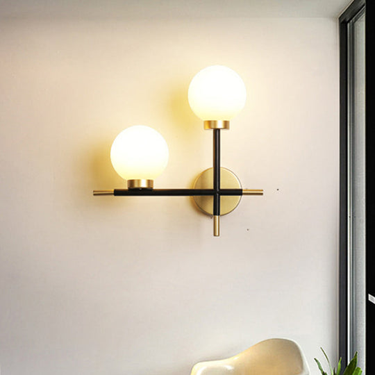 Modern Black Double Globe Wall Lamp With Cross Design - 2-Bulb Milky Glass Sconce Light Fixture For