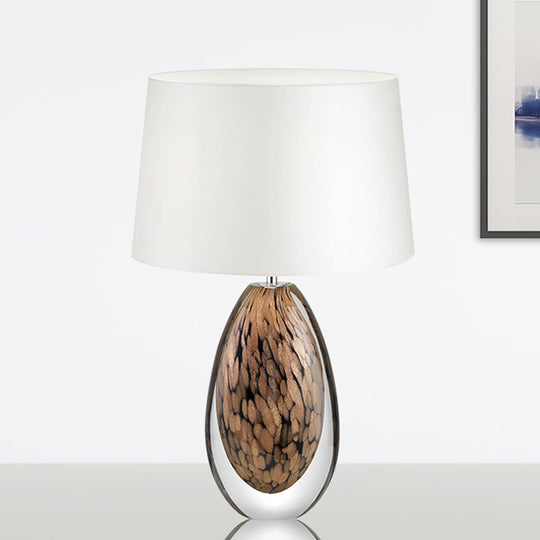 Modernist White Fabric Desk Lamp With Teardrop Brown Glazed Crystal Base - 1 Head Tapered Table