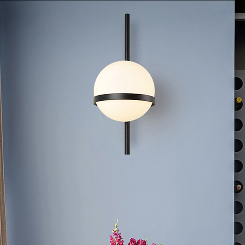 Modern Black/Gold Vertical Wall Sconce With Orbit Opal Glass Shade - 1 Head Metal Lamp 6/8 Width