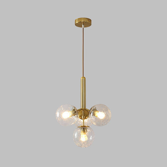 Modernist Gold Globe Pendant Light Fixture - Clear Water Glass, 4 Heads