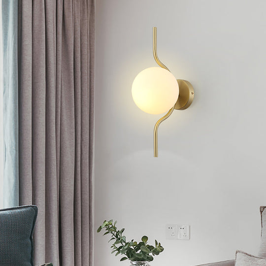 Globe White Glass Wall Mount Sconce Light With Elegant Gold Arm And Base