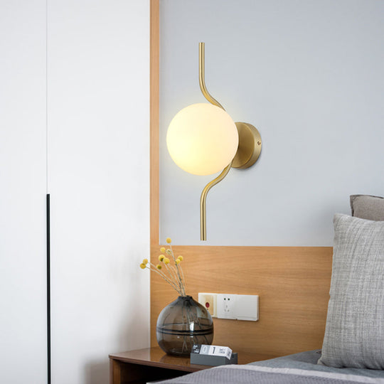 Globe White Glass Wall Mount Sconce Light With Elegant Gold Arm And Base