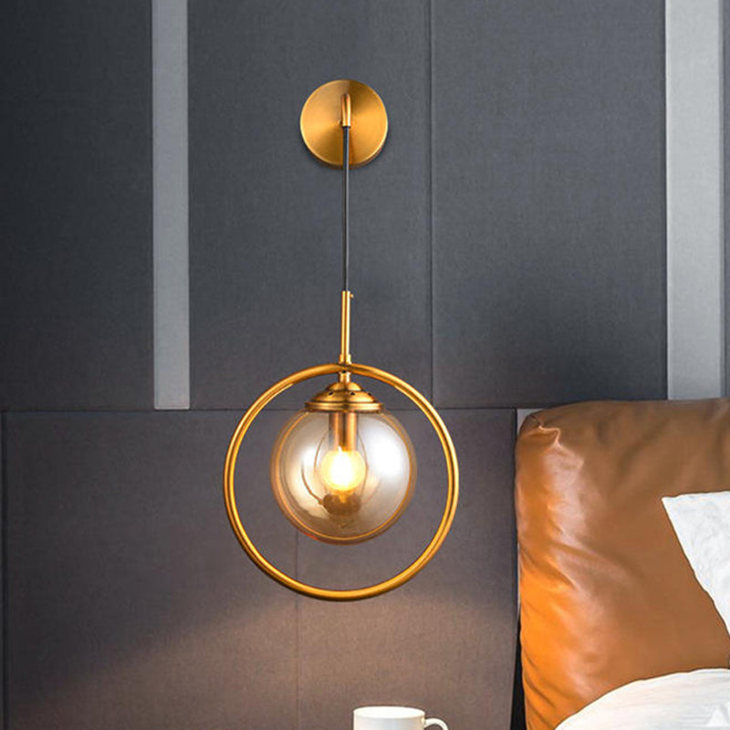 Modern Brass Wall Sconce With Glass Sphere Shade For Bedside Lighting