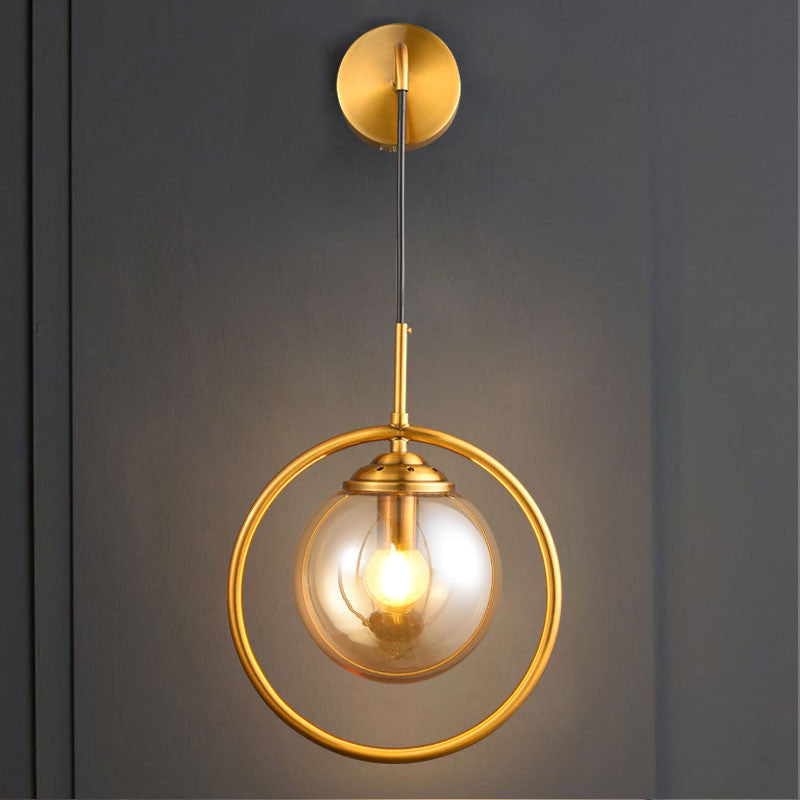 Modern Brass Wall Sconce With Glass Sphere Shade For Bedside Lighting