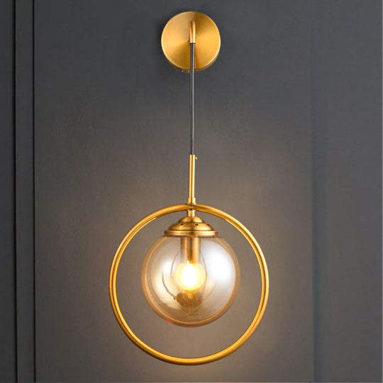 Modern Brass Wall Sconce With Glass Sphere Shade For Bedside Lighting