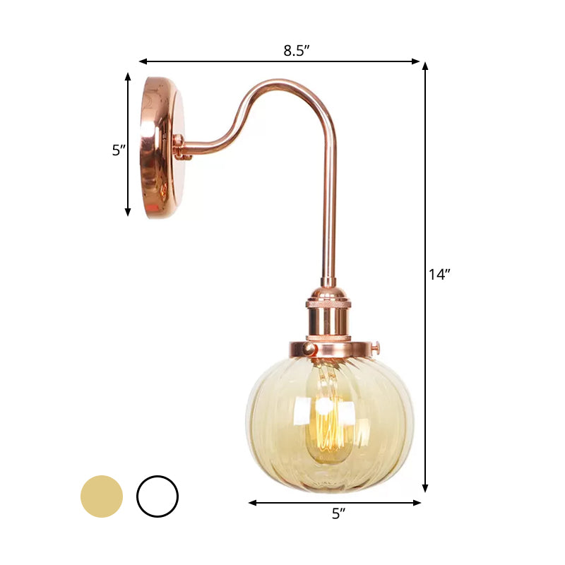 Copper Vintage Globe Wall Sconce With Curved Arm And Clear/Amber Glass - 1 Light