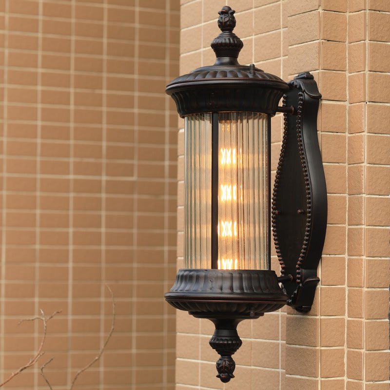 Country-Style Black Wall Sconce Lamp With Clear Ribbed Glass Cylinder Light