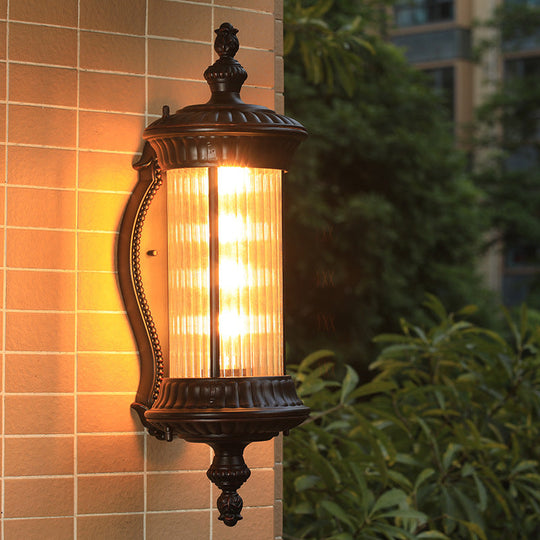 Country-Style Black Wall Sconce Lamp With Clear Ribbed Glass Cylinder Light