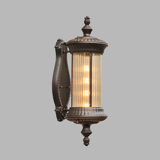 Country-Style Black Wall Sconce Lamp With Clear Ribbed Glass Cylinder Light