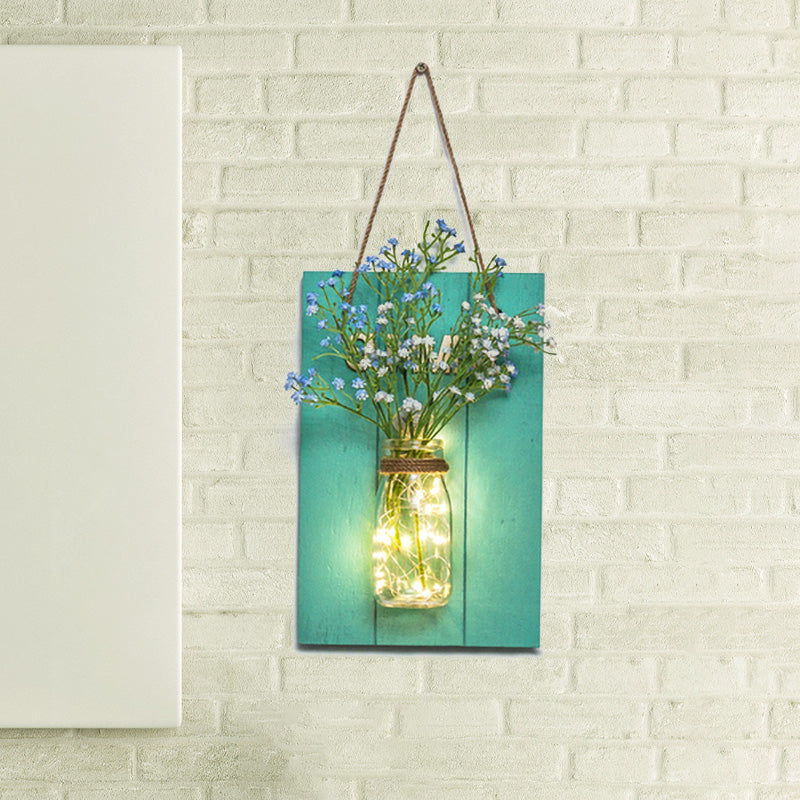 Clear Bottle Wall Sconce With Led And Rustic Teal Plant Decoration