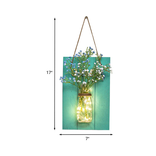 Clear Bottle Wall Sconce With Led And Rustic Teal Plant Decoration