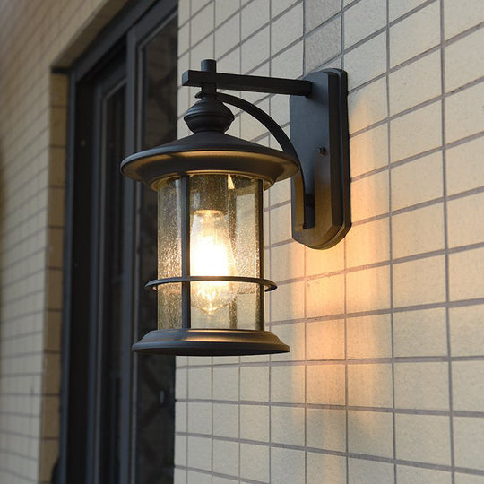 Clear Seeded Glass Cylinder Sconce Outdoor Wall Mounted Lamp For Garden - 1-Bulb Black/Coffee Finish