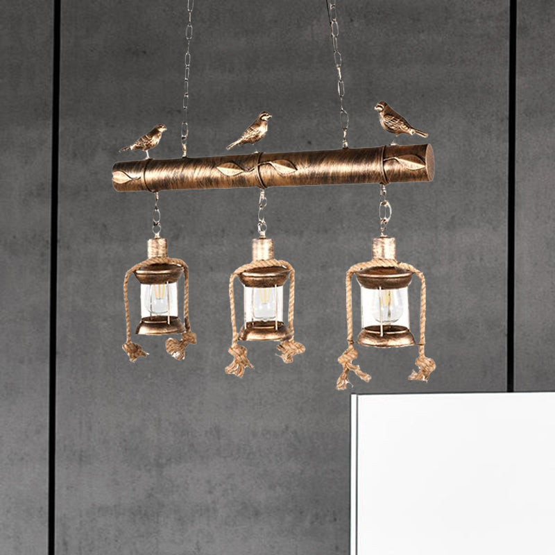 Antique Brass Lantern Pendant With Clear Glass And Bird Accent - 3-Light Coastal Island Kit