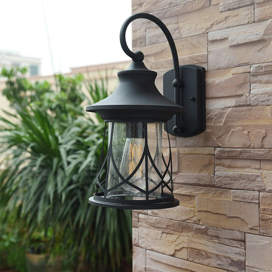 Industrial Porch Sconce With Seeded Glass Lantern Shade And One Bulb