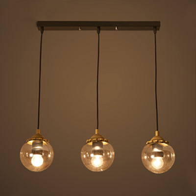 Modern 3-Light Clear Glass Pendant Lamp in Black for Coffee Shops - Orb Design with Linear/Round Canopy