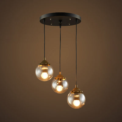 Modern 3-Light Clear Glass Pendant Lamp in Black for Coffee Shops - Orb Design with Linear/Round Canopy