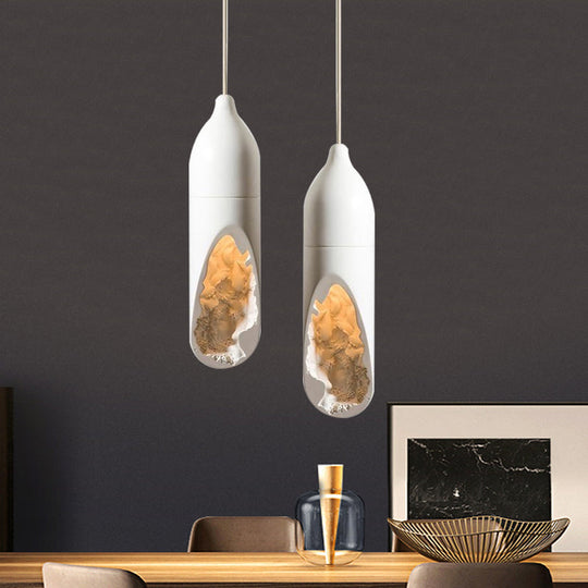 Resin Farmhouse Pendant Light With Hollow-Out Design In White - Pill-Shaped Ceiling Lamp For Dining