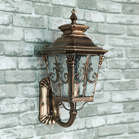 Country Brass Outdoor Wall Sconce With Pointed Flower Design