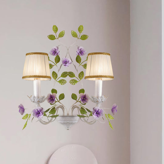 White Wall Sconce With Purple Flower Design And Pleated Shade For Bedroom Decor